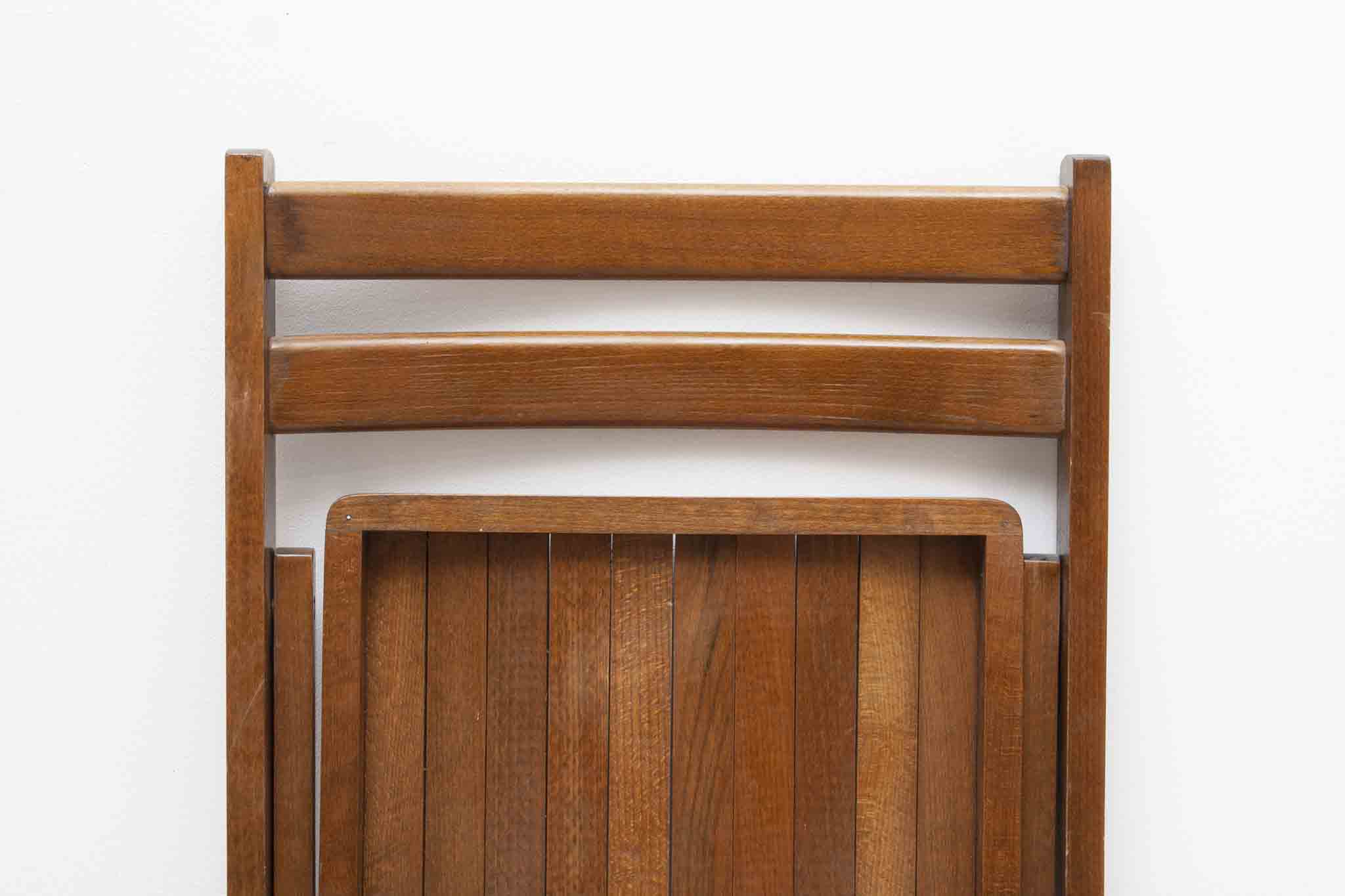 Vintage folding wooden chair with half-moon seat