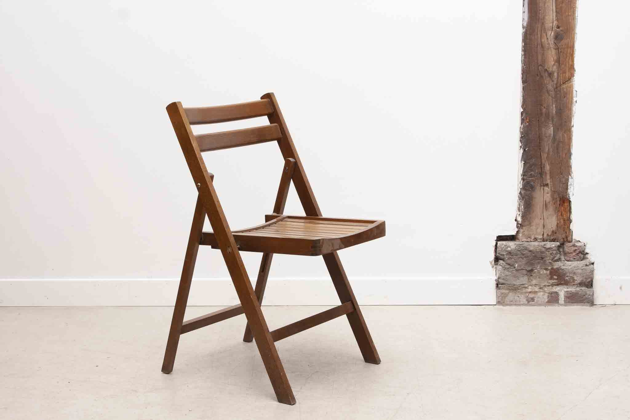 Vintage folding wooden chair with half-moon seat