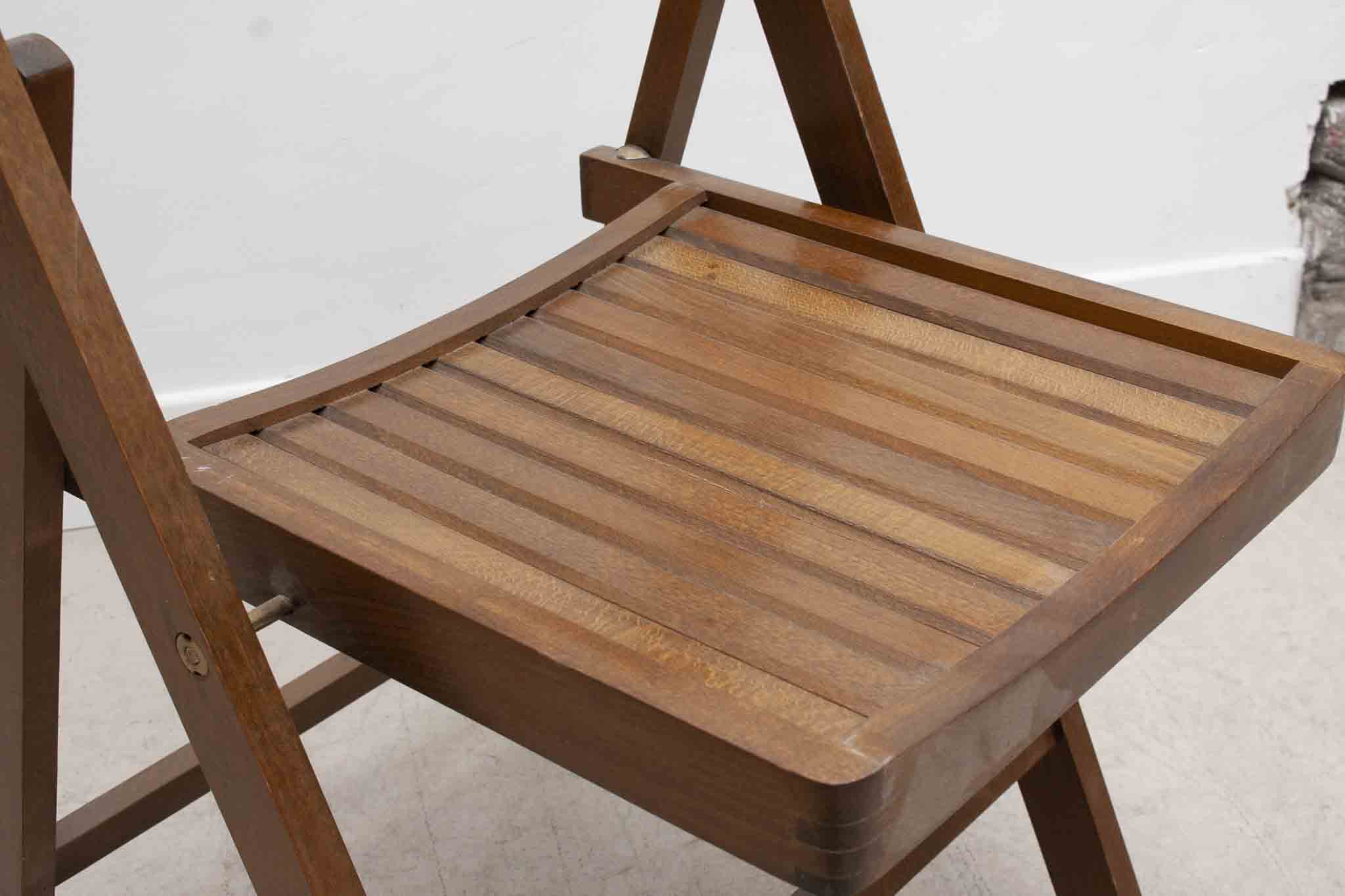 Vintage folding wooden chair with half-moon seat