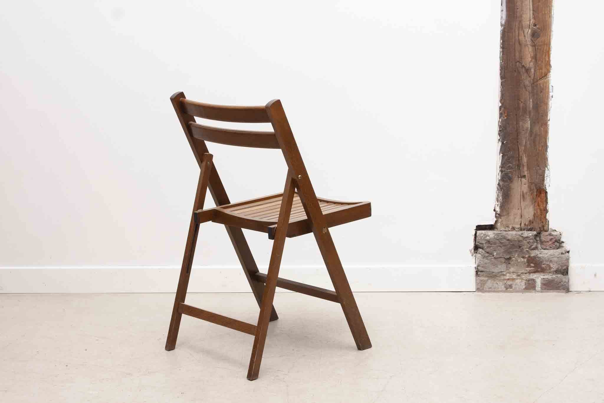 Vintage folding wooden chair with half-moon seat