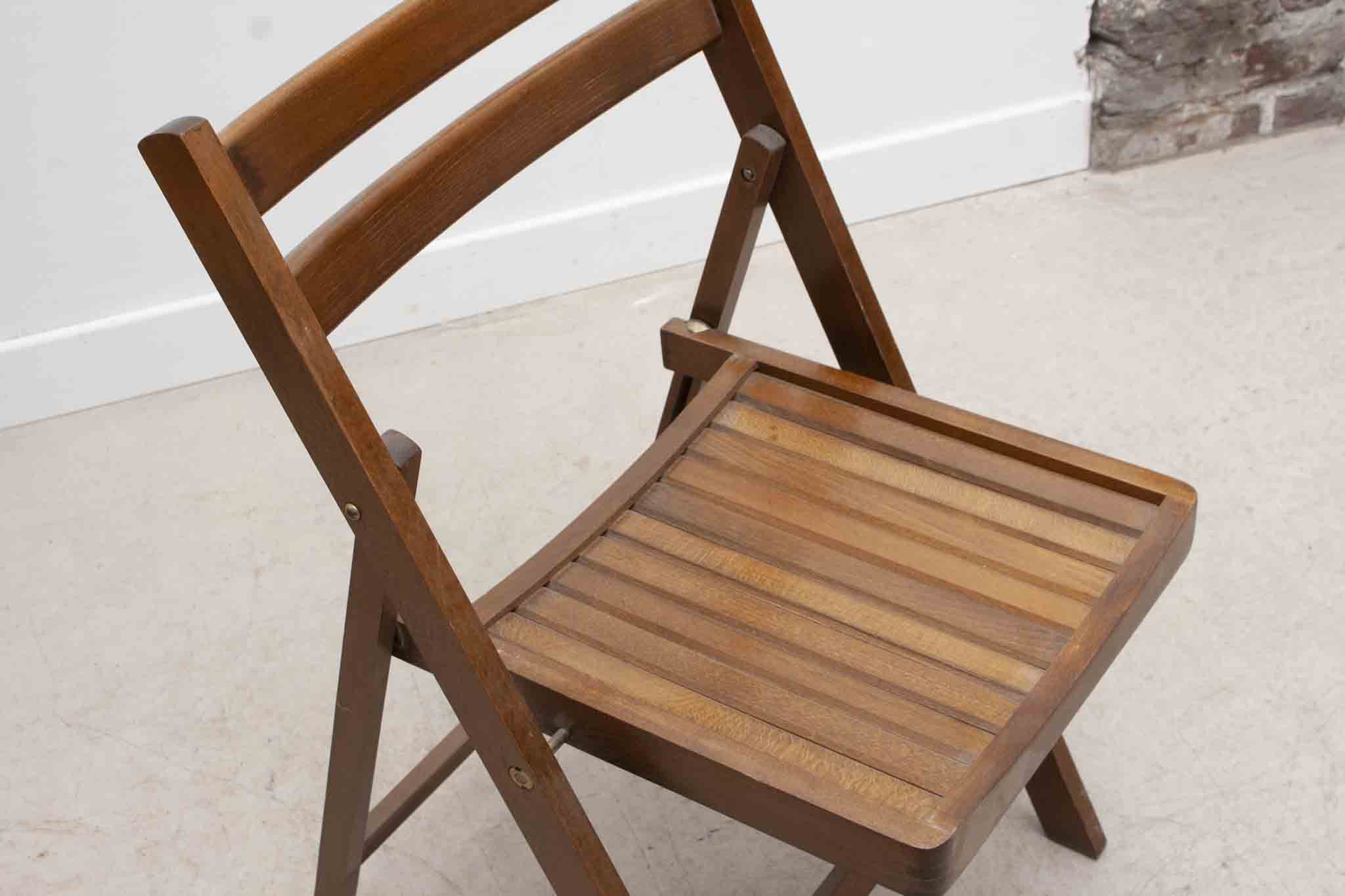 Vintage folding wooden chair with half-moon seat