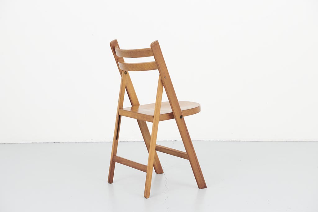 Vintage folding wooden chair with half-moon seat