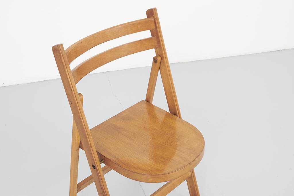 Vintage folding wooden chair with half-moon seat