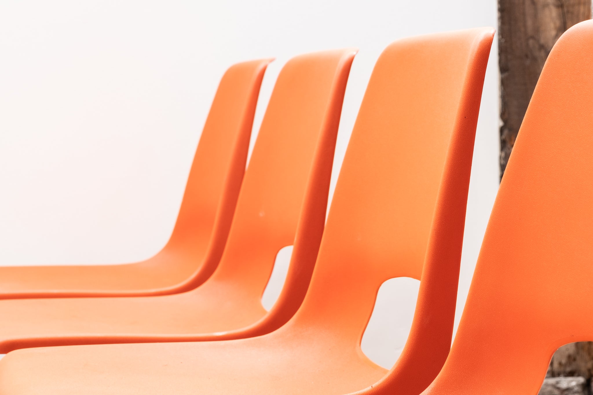 Stackable orange plastic patio chair